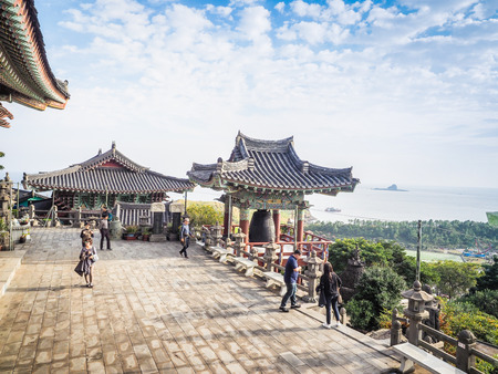 Jeju Island, KOREA - NOVEMBER 12: The tourist visited Sanbanggulsa temple that located on Sanbangsan Mountain. On the way to the cave, with the temple in it you have multiple buildings - 12 NOVEMBER 2016のeditorial素材