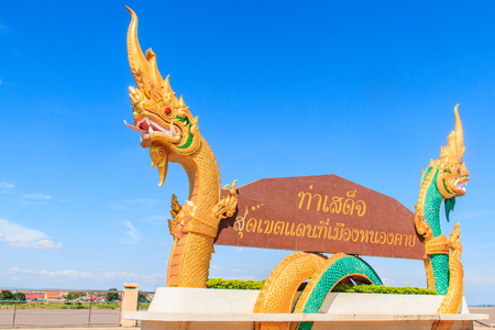 Beautiful Nagas on billboard. Words on the billboard Translated from Thai to English as " Tha Sadet Pier, the edge of Thailand border at Nong Khai City".のeditorial素材