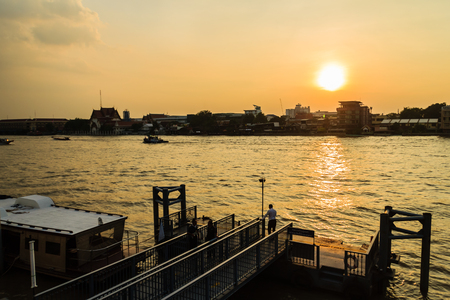 Bangkok, Thailand - October 14, 2016: Tha Maharaj boat pier in the evening on Chao Phaya river nearby the Grand Palaceの写真素材