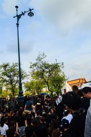 BANGKOK THAILAND - October 14, 2016 : Crowd of Thai people watch the royal procession transferring the body of the King, who passed away on October 13, 2016, at the Grand Palace, Bangkok., Thailand,のeditorial素材