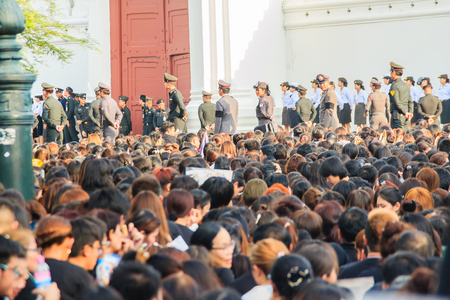 BANGKOK THAILAND - October 14, 2016 : Crowd of Thai people watch the royal procession transferring the body of the King, who passed away on October 13, 2016, at the Grand Palace, Bangkok., Thailand,のeditorial素材