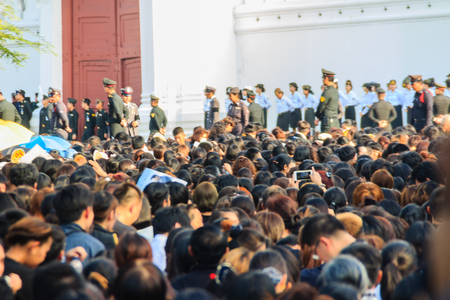 BANGKOK THAILAND - October 14, 2016 : Crowd of Thai people watch the royal procession transferring the body of the King, who passed away on October 13, 2016, at the Grand Palace, Bangkok., Thailand,のeditorial素材
