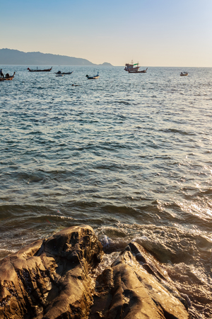 Fisherman boat and the Beautiful seascape view of Kalim beach, nearby Patong beach, Kathu District, Phuket, Thailand.の写真素材