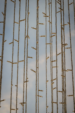 Line of Glittering LED lights decorated for Christmas eve in daylight. It's will beautiful on nightの写真素材