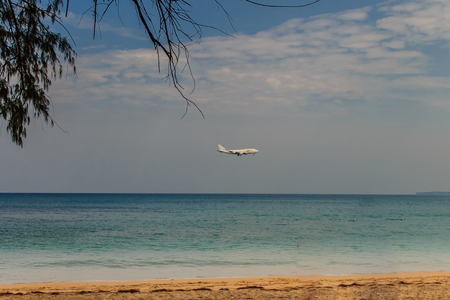 The airplane is landing at Phuket international airport, Phuket Province, Thailand.のeditorial素材