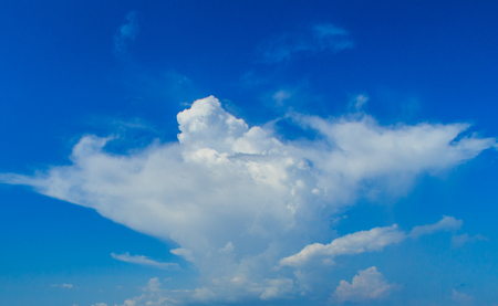 Clear blue sky with white clouds. Cloudless sky. Blue sky with a cloud obscured the view daytime desolate empty air clean.の写真素材