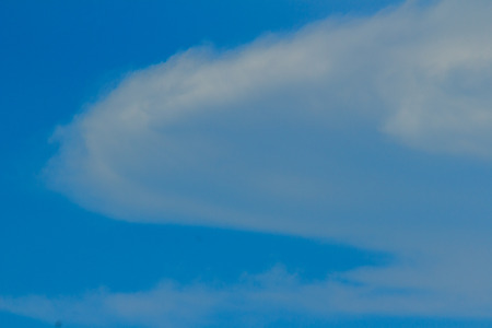 Clear blue sky with white clouds. Cloudless sky. Blue sky with a cloud obscured the view daytime desolate empty air clean.の写真素材