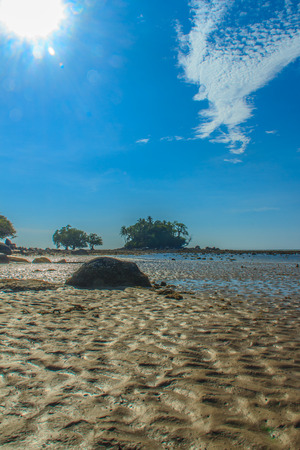 Exotic and beautiful wave pattern on the sand in the beach after sea water receded.の写真素材