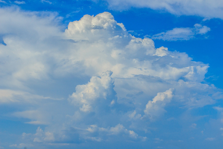 Clear blue sky with white clouds. Cloudless sky. Blue sky with a cloud obscured the view daytime desolate empty air clean.の写真素材