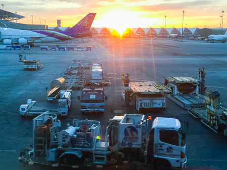 Bangkok, Thailand - November 20, 2015: Beautiful sunrise at Suvarnabhumi Airport after the tourist checked-in for morning flights at approximately 0630 hours.のeditorial素材