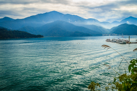 Beautiful Landscape of Sun Moon Lake in the morning with blue mountain background at Nantou, Taiwanのeditorial素材