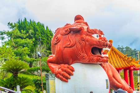 A Chinese Guardian Lion with the ball can be seen at the main entrance outside of Wenwu Temple in Puli County of Taiwanのeditorial素材