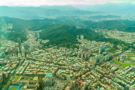 Aerial panorama over Taipei, capital City of Taiwan, on a blue sky and cloudy dayの写真素材