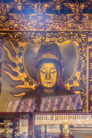 Beautiful Guanyin sculpture at Lungshan Temple of Manka,  Buddhist temple in Wanhua District, Taipei, Taiwan. The temple was built in Taipei in 1738 by settlers from Fujian during Qing rule in honor of Guanyin.の写真素材