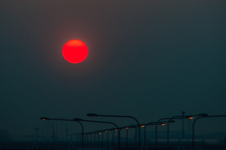 Beautiful Nature Egg Yolk Sunrise with colourful sky environment. Sun egg yolk, beautiful calm sky with orange sunrise in the morning at the airport. Morning sun egg yolk with silhouette background.の写真素材