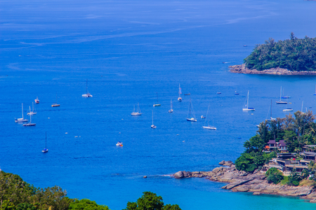 Tropical beach landscape panorama. Beautiful turquoise ocean waives with boats and sandy coastline from high view point. Kata and Karon beaches, Phuket, Thailandの写真素材