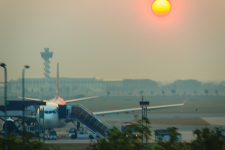 Beautiful Nature Egg Yolk Sunrise with colourful sky environment. Sun egg yolk, beautiful calm sky with orange sunrise in the morning at the airport. Morning sun egg yolk with silhouette background.の写真素材