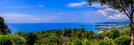 Beautiful panorama landscape view of turquoise ocean waves with boats, coastline and blue sky background from high aerial view point of Kata and Karon beaches in Phuket Thailand. の写真素材