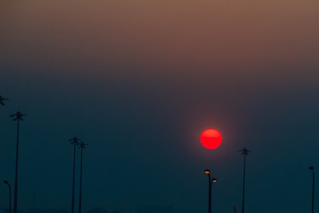Beautiful Nature Egg Yolk Sunrise with colourful sky environment. Sun egg yolk, beautiful calm sky with orange sunrise in the morning at the airport. Morning sun egg yolk with silhouette background.の写真素材