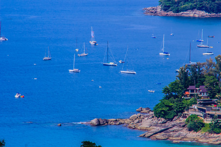Tropical beach landscape panorama. Beautiful turquoise ocean waives with boats and sandy coastline from high view point. Kata and Karon beaches, Phuket, Thailandの写真素材