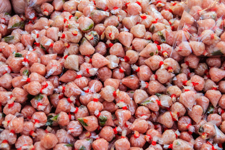 Close-up Thai style fermented sausage called Neam in a plastic bag wrap and ready for sell in Thailand fresh market.の写真素材