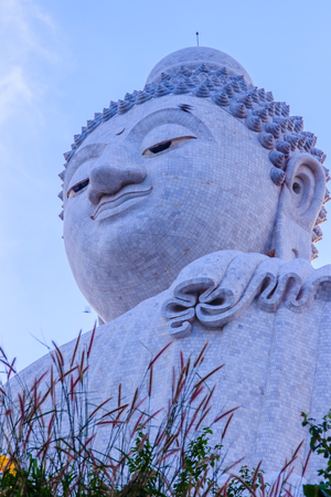 Amazing Massive white marble Buddha statue, the famous tourist attraction on top of hill in Phuket, Thailand.の写真素材