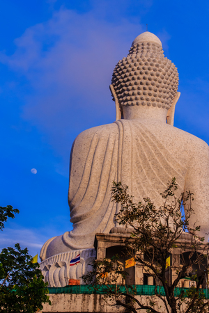 Amazing Massive white marble Buddha statue, the famous tourist attraction on top of hill in Phuket, Thailand.の写真素材