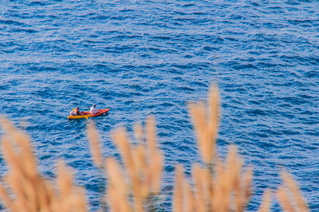 Beautiful landscape and Seascape views of canoeing at Laem Promthep or Promthep cape, the most popular sunset view point and landmark of Phuket, Thailand.の写真素材