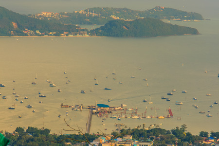 Beautiful view of Ao Chalong bay, aerial view from the big Buddha mountain. At this point,  tourists can enjoy the 360-degree view of Chalong bay pier including Phuket city.の写真素材