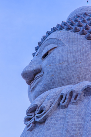 Amazing Massive white marble Buddha statue, the famous tourist attraction on top of hill in Phuket, Thailand.の写真素材