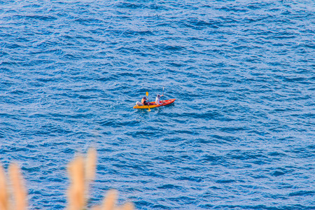 Beautiful landscape and Seascape views of canoeing at Laem Promthep or Promthep cape, the most popular sunset view point and landmark of Phuket, Thailand.の写真素材