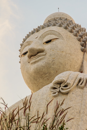 Amazing Massive white marble Buddha statue, the famous tourist attraction on top of hill in Phuket, Thailand.の写真素材