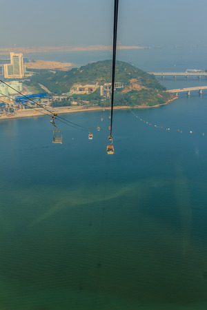 Lantau Island, Hong Kong - November 14, 2014: Beautiful view from Hong Kong cable cars, the popular public transportation from Tung Chung Station to Ngong Ping village, Lantau Island, Hong Kong.のeditorial素材