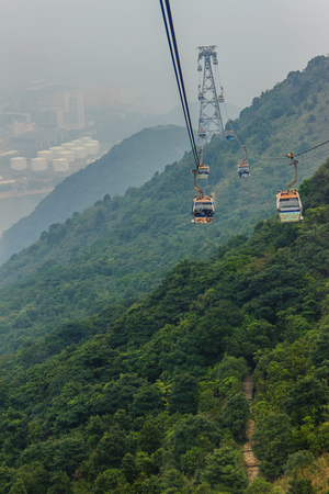 Lantau Island, Hong Kong - November 14, 2014: Beautiful view from Hong Kong cable cars, the popular public transportation from Tung Chung Station to Ngong Ping village, Lantau Island, Hong Kong.のeditorial素材