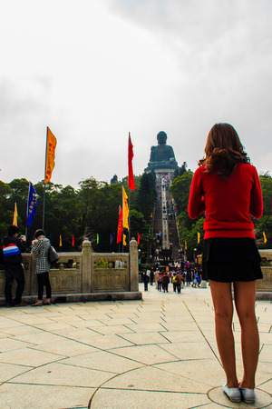 Lantau Island, Hong Kong - November 14, 2014: The tourist visited Giant Tian Tan Buddha statue on the peak of the mountain at Po Lin Monastery in Lantau Island, Hong Kong.のeditorial素材