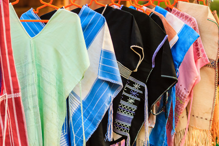 Beautiful Thai tribal clothes and tribal textile style in the northern of thailand. Beautiful handmade tribal cloth ethnic patterns for sale in the local market.の写真素材