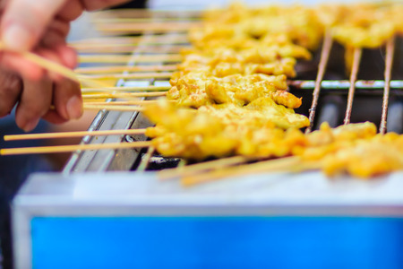 Grilling Pork satay, Thai steak roasted pork grilling on the fire charcoalの写真素材