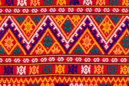 Colorful of native thai style silk and textiles pattern. Beautiful handmade woven fabrics thai silk fabric textured, with different native style patterns.の写真素材