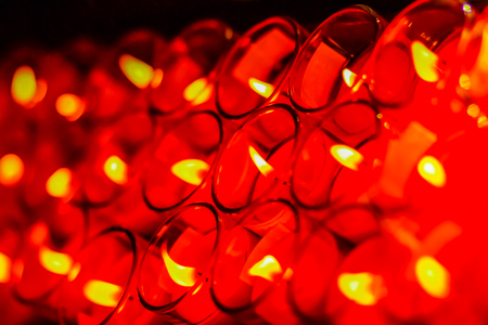 Beautiful red-orange light of many worship candlesの写真素材