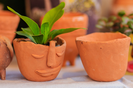Beautiful handmade ceramic pot and vase in exotic patterns at night market.の写真素材