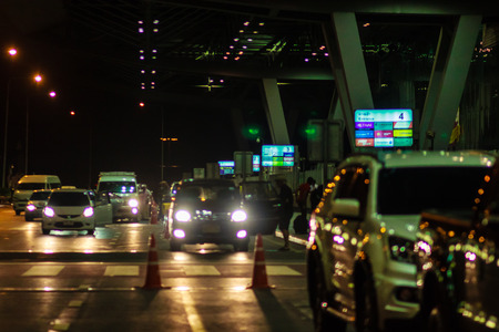 Bangkok, Thailand - February 21, 2017: Tourist was arrived at Suvarnabhumi International Airport for morning flight departure during traffic jam. Shot on late night with poor light and grain.のeditorial素材