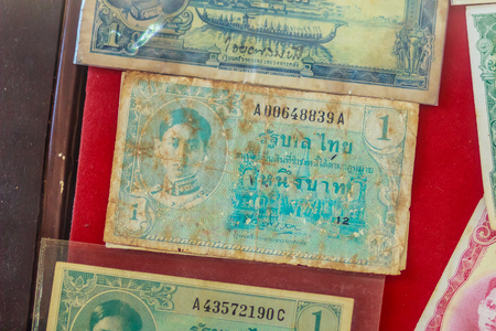 Old Thai one Baht banknotes with king Ananda Mahidol image since word war ii period for people who like to collect antique object. Vintage Thai King Ananda Mahidol banknotes collection.の写真素材