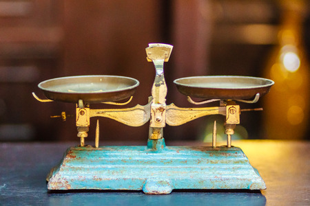 Old Golden weighing scale balance, Ancient old scale, Vintage old brass weight scale for people who like to collect the antique objects.の写真素材