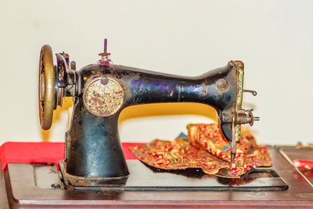 Old black sewing machine for antique or vintage collector.の写真素材