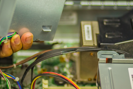 Close up hands of technician during repair desktop computerの写真素材