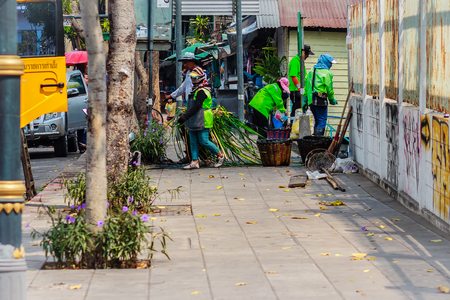 Bangkok, Thailand - February 22, 2017: Bangkok municipal staff in canal dredging work to dump vegetation trash to drain quickly. Dredgers, ditches, weeds and water barriers are dredged.のeditorial素材