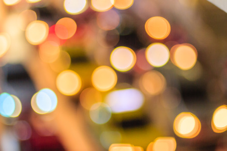Abstract blur bokeh of Evening traffic jam on road in city. Out of focus lights from cars in a...