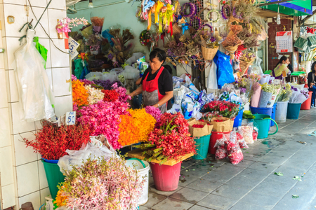 Bangkok, Thailand - March 2, 2017: Flower shop selling variety of flowers at the flower market named "Pak Khlong Talat" in Bangkok. Pak Klong Talad is the biggest flower market in Thailand.のeditorial素材