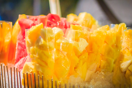 Sliced pineapple for sale at Khaosan Road night market, Bangkok Thailandの写真素材
