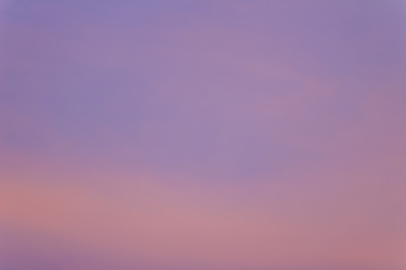 Red clouds on blue sky in twilight evening. Beautiful sunset sky with blue and red background. Dramatic colorful of dusk and dawn sky with blue sky and red clouds.の写真素材